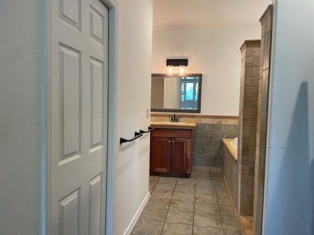 55 Palulu Way Unit A, Haiku, HI 96708 - bathroom featuring vanity, tiled tub, and tile walls