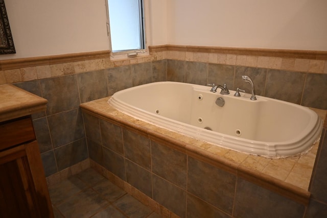 55 Palulu Way Unit A, Haiku, HI 96708 - bathroom featuring a tub with jets, vanity, and a wainscoted wall