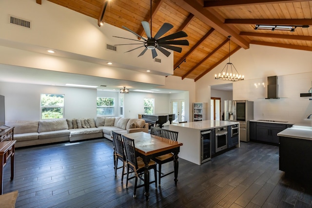 55 Palulu Way Unit A, Haiku, HI 96708 - dining area featuring a wooden ceiling with exposed beams, wine cooler, dark wood-type flooring, ceiling fan, and a chandelier