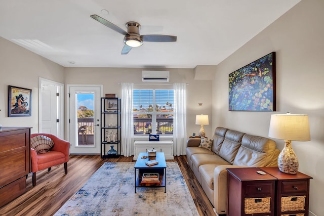 3708 Lower Honoapiilani Rd Unit E-33, Lahaina, HI 96761 - living area featuring a wall mounted AC, wood finished floors, healthy amount of natural light, and a ceiling fan