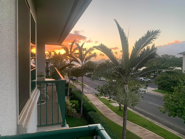 view of balcony at dusk