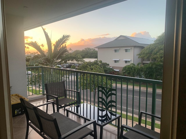 view of balcony at dusk