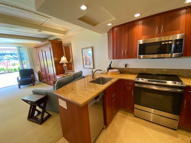 kitchen with kitchen peninsula, light tile patterned floors, stainless steel appliances, and sink