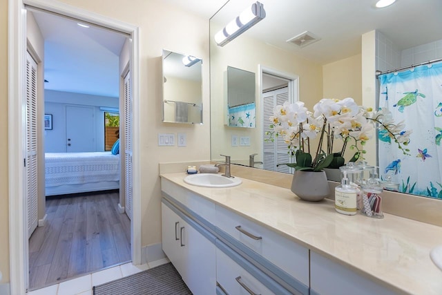 bathroom featuring tile patterned floors and vanity