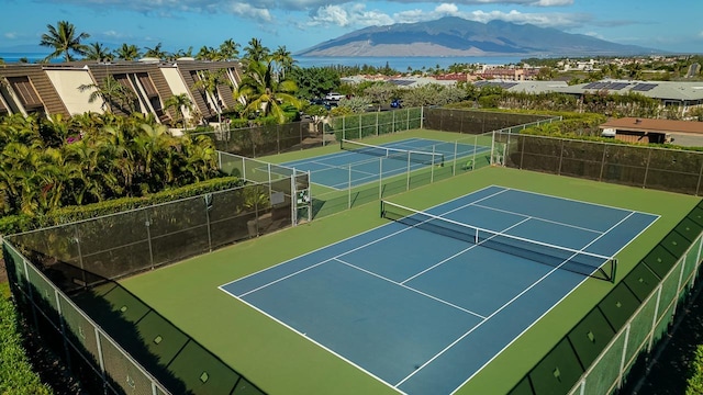 view of tennis court with a mountain view and basketball court