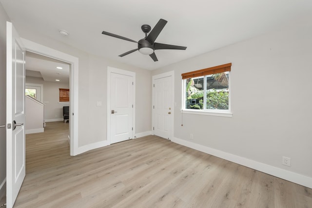 unfurnished bedroom with ceiling fan and light hardwood / wood-style flooring