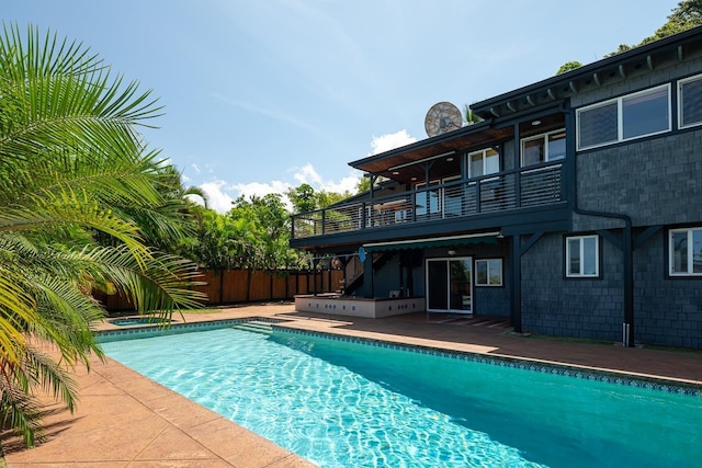 view of pool with a patio area and a hot tub