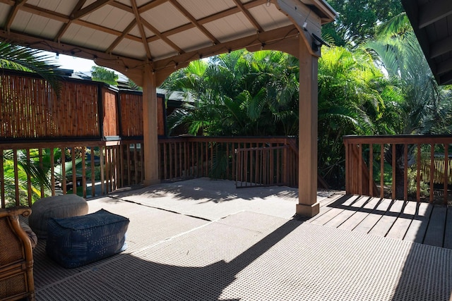 wooden deck featuring a gazebo