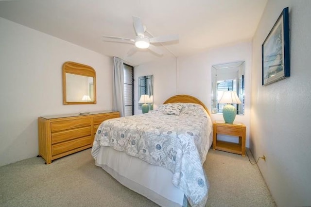 190 Hauoli St Unit 220, Wailuku, HI 96793 - bedroom with light colored carpet and a ceiling fan