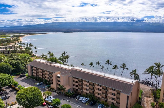 exterior space with a water and mountain view