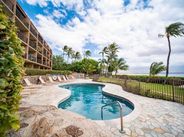 view of swimming pool with a patio area