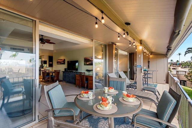 2661 Kekaa Dr Unit L-202, Lahaina, HI 96761 - view of patio / terrace with a balcony, a ceiling fan, and outdoor dining space
