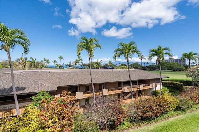 2661 Kekaa Dr Unit L-202, Lahaina, HI 96761 - view of side of home with a shingled roof and stucco siding