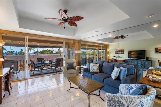 2661 Kekaa Dr Unit L-202, Lahaina, HI 96761 - living area with ceiling fan, a tray ceiling, and tile patterned floors