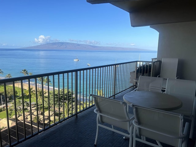 balcony with a water and mountain view