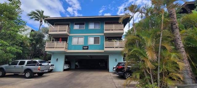 view of front of house with a balcony and a garage