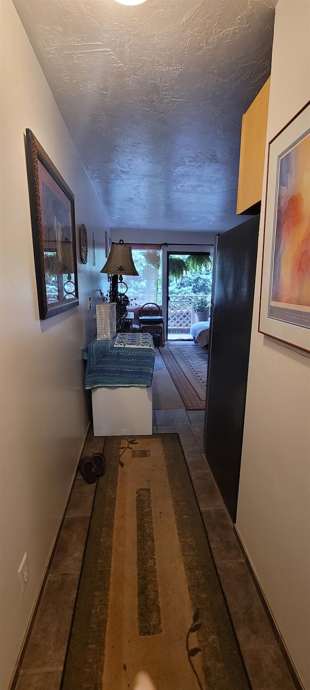 hallway featuring a textured ceiling