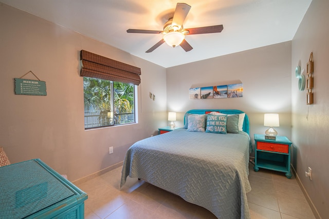 tiled bedroom with ceiling fan