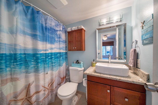 bathroom featuring a shower with curtain, vanity, toilet, and tile patterned floors