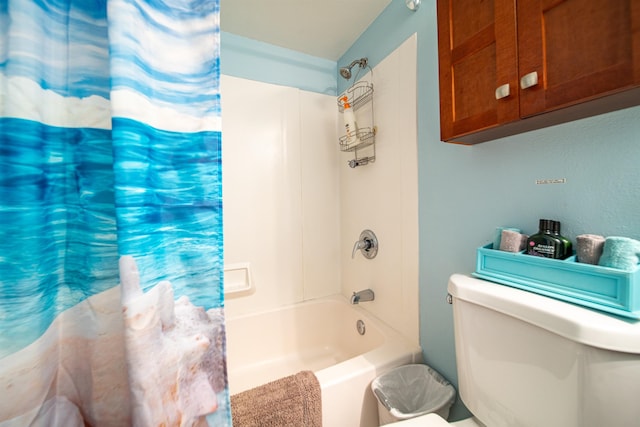 bathroom featuring toilet and shower / tub combo with curtain