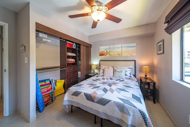 tiled bedroom with ceiling fan