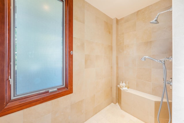 bathroom with a tile shower