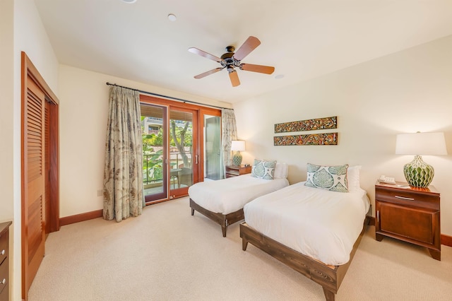 carpeted bedroom featuring ceiling fan, a closet, and access to outside