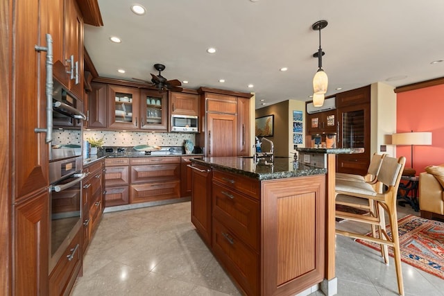 kitchen with a kitchen breakfast bar, a wall mounted air conditioner, stainless steel appliances, backsplash, and recessed lighting