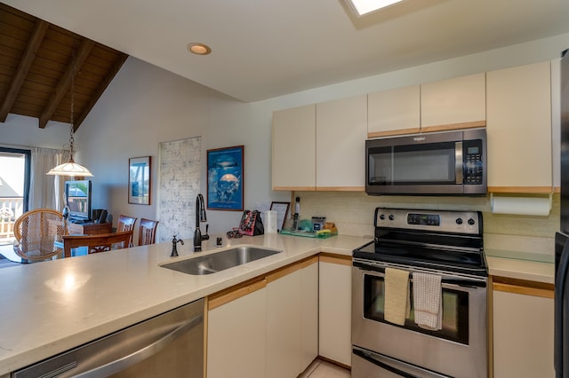 kitchen with kitchen peninsula, appliances with stainless steel finishes, wood ceiling, sink, and lofted ceiling with beams