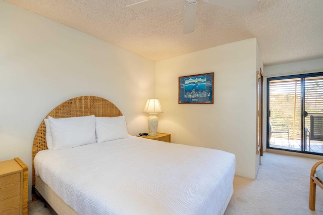 bedroom with carpet flooring, ceiling fan, and a textured ceiling