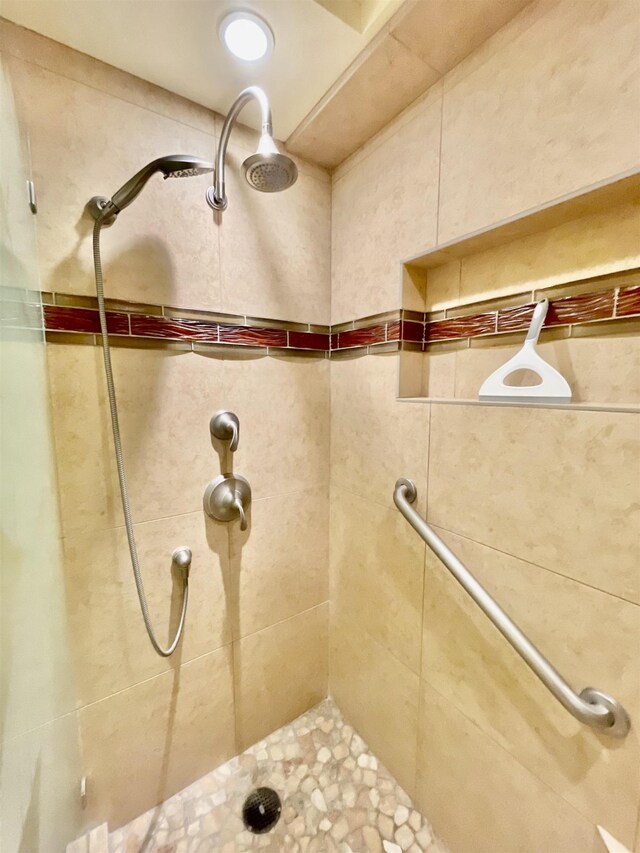 bathroom with tiled shower