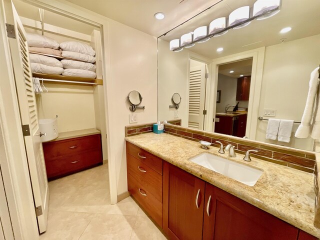 bathroom with tile patterned flooring and vanity