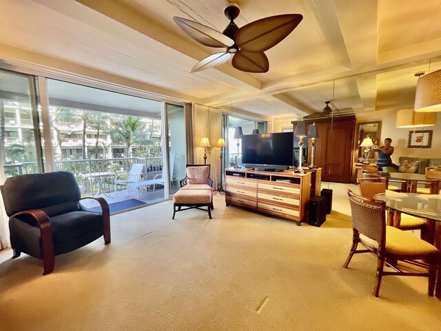 living room with light colored carpet and ceiling fan