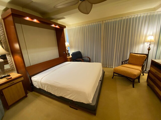 carpeted bedroom featuring ceiling fan