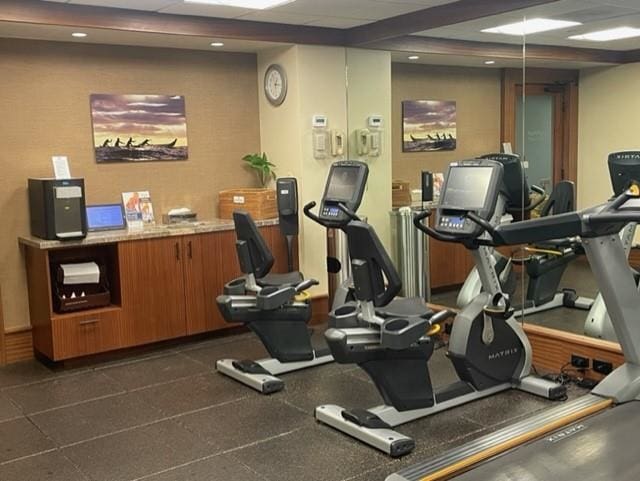 gym featuring a paneled ceiling