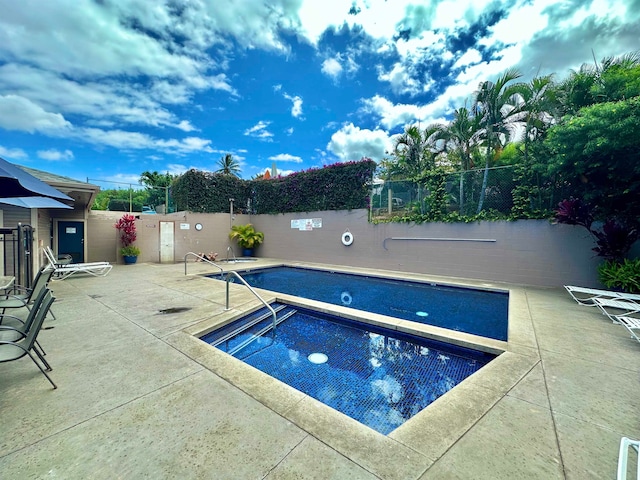 view of pool featuring a patio