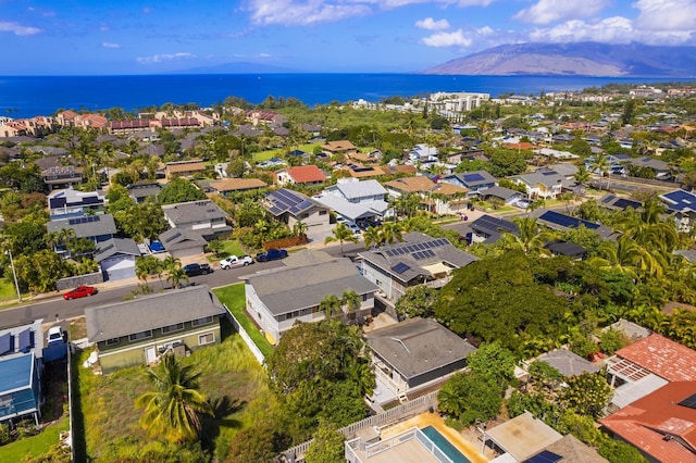 birds eye view of property featuring a water view and a residential view