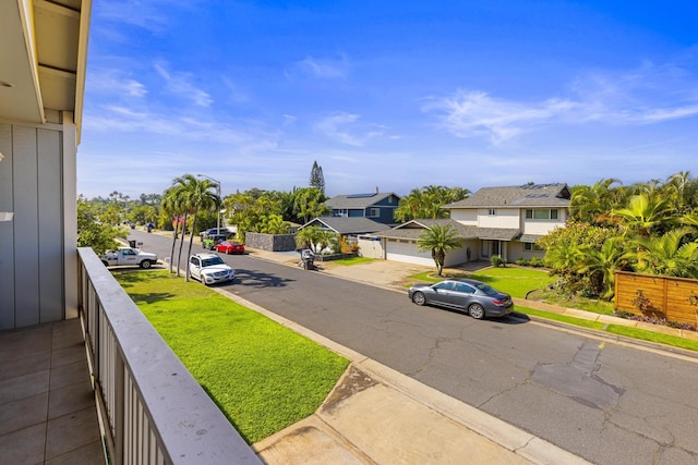 exterior space featuring sidewalks, a residential view, and curbs