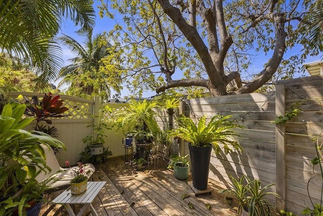 wooden deck featuring fence