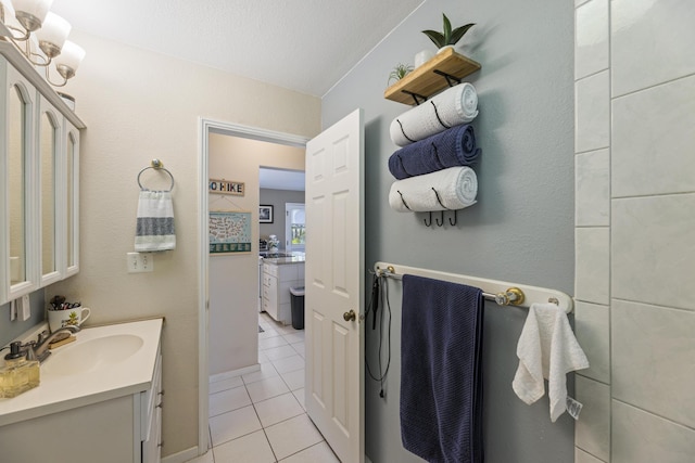 bathroom featuring tile patterned flooring and vanity