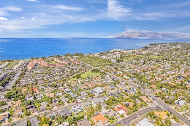 drone / aerial view with a residential view and a water and mountain view