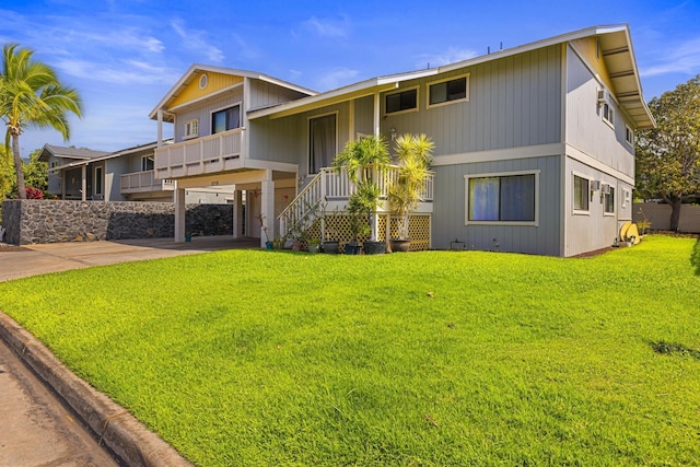 view of front of house with a front lawn and stairway