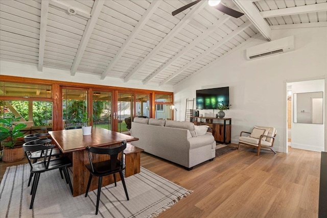living area with a wall mounted AC, light wood finished floors, high vaulted ceiling, beamed ceiling, and ceiling fan