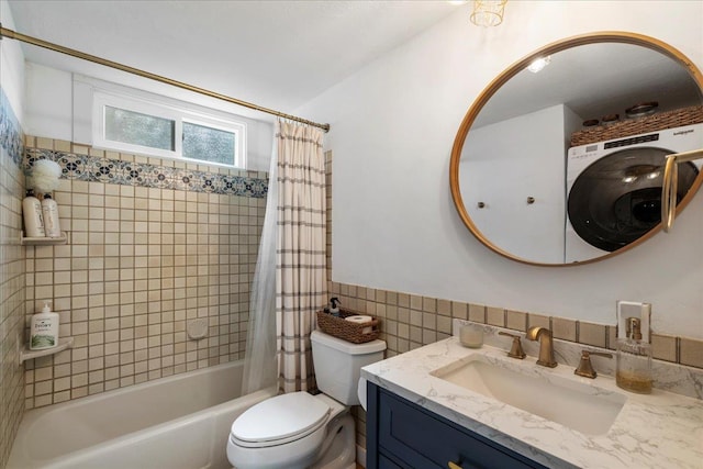 full bath with tile walls, shower / bath combination with curtain, vanity, toilet, and a wainscoted wall