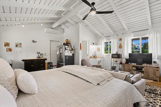 bedroom with freestanding refrigerator, a wall mounted air conditioner, a sink, beamed ceiling, and wood finished floors
