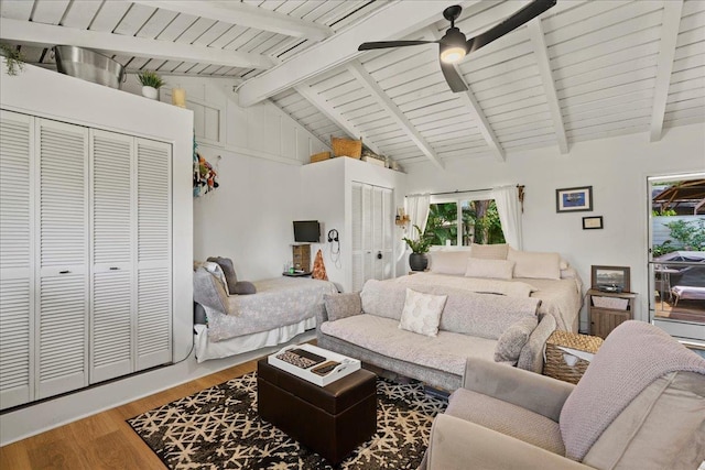 living room featuring wood finished floors, a ceiling fan, and wood ceiling