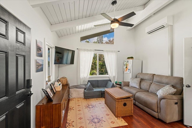 living area featuring an AC wall unit, wood finished floors, beamed ceiling, a ceiling fan, and wooden ceiling