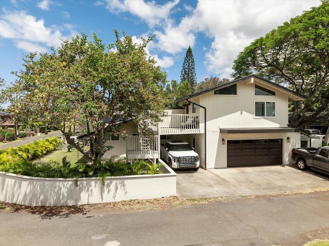 view of front of property featuring an attached garage and concrete driveway