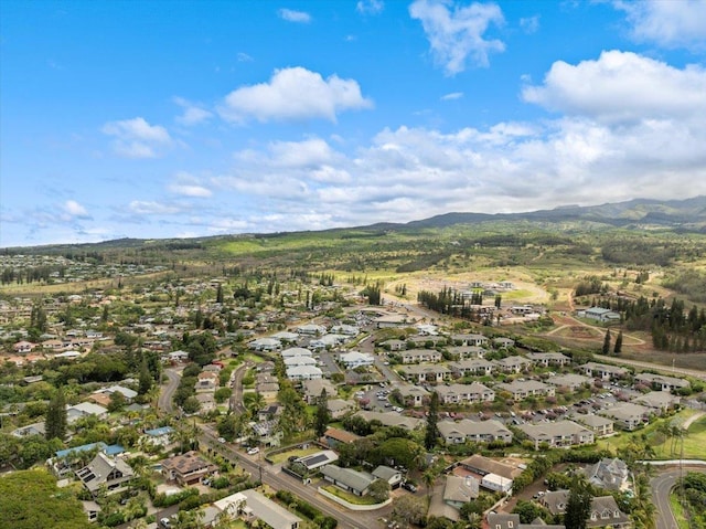 aerial view of property and surrounding area with mountains and nearby suburban area