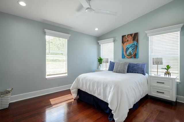 bedroom featuring baseboards, multiple windows, and dark wood-style floors